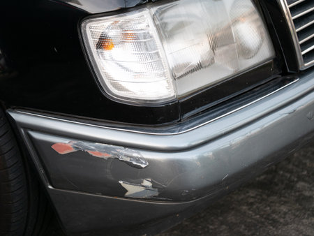 Car damage inspection urban setting image of vehicle close-up view automotive maintenance conceptの写真素材