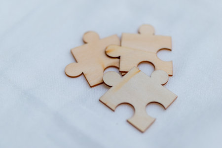 Strategizing business growth puzzle piece collaboration in a creative workspace environmentの写真素材