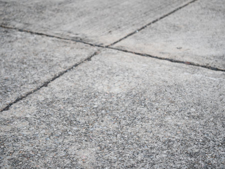 Concrete surface patterns urban environment high-resolution image outdoor setting ground level textural details for visual appealの写真素材