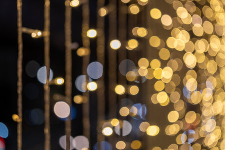 Twinkling holiday lights decorating a cityscape urban nightlife photography cozy atmosphere close-up festive spiritの写真素材