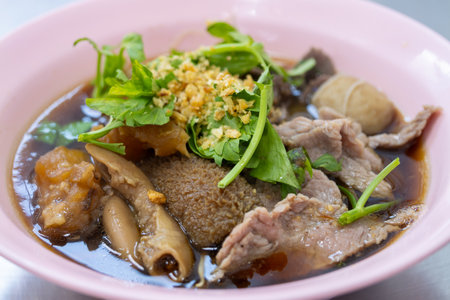 Delicious bowl of traditional asian noodle soup street food market culinary delight urban...