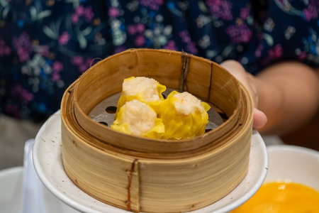 Delicious dim sum experience local restaurant food photography cozy environment close-up view culinary delightの写真素材