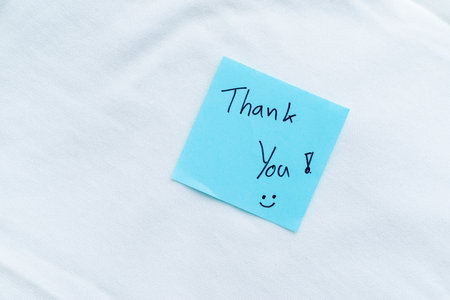 Gratitude note appreciation office setting visual message minimalistic environment close-up view business communication conceptの写真素材