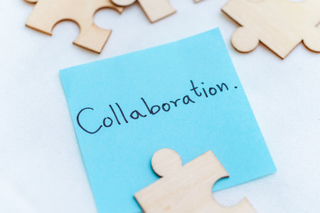 Collaboration in business strategies creative workspace close-up view teamwork concepts blue note emphasizing team spiritの写真素材