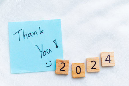 Gratitude for 2024 a business perspective on the new year desk setting note and blocks motivational environment close-up view reflectionの写真素材