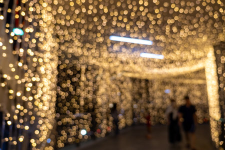 Festive lighting display urban shopping center decorative installation nighttime ambiance close-up...