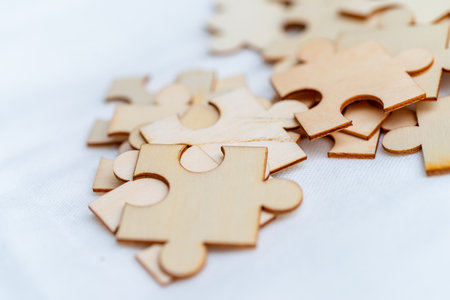 Strategizing business growth puzzle pieces of success in a creative workspace environmentの写真素材