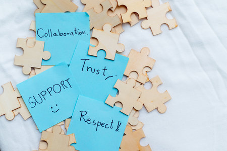 Collaboration and trust building in business office environment visual content puzzle piece concept team dynamics for enhanced performanceの写真素材