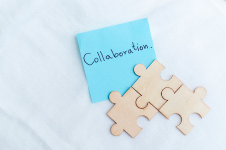 Collaboration in business puzzle piece concept office space visual representation creative environment close-up view teamwork insightsの写真素材