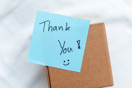 Business appreciation gesture home office thank you note calm environment close-up view gratitude concept for seo impactの写真素材
