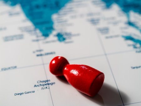 Exploring global geography close-up of red pawn on world map for travel learning
