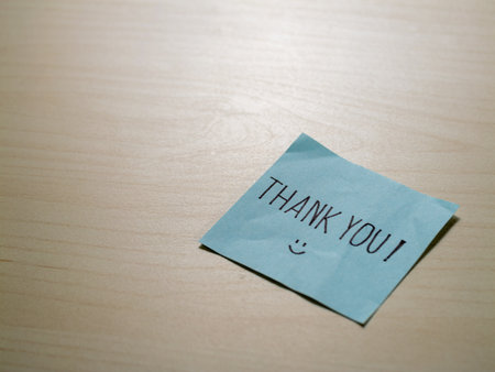 Minimalist style thank you note on desk an inspiring gratitude messageの写真素材