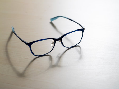 Stylish eyeglasses in a modern home office close-up product photographyの写真素材