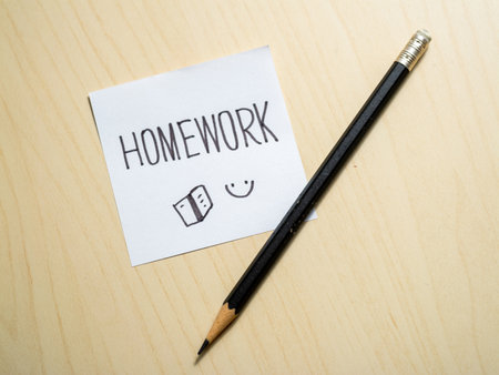 Homework reminder note student desk educational content indoor close-up view study motivationの写真素材