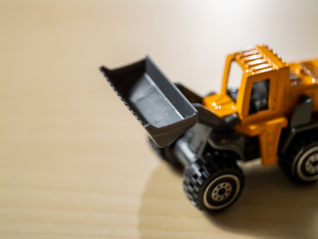 Close-up of toy construction vehicle in playroom boosting children's imaginationの写真素材