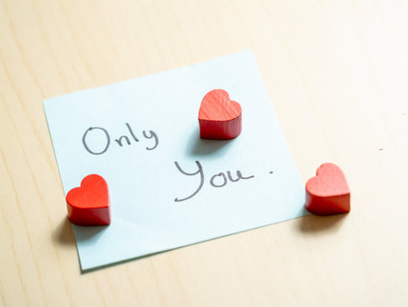 Heart-shaped tokens and sentimental notes a close-up of romantic gestures in loveの写真素材