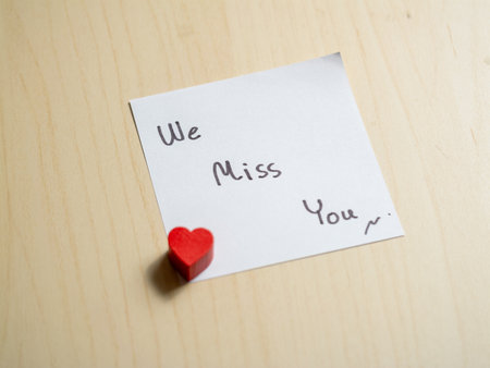 Heartfelt message of longing home note indoor close-up emotional connection