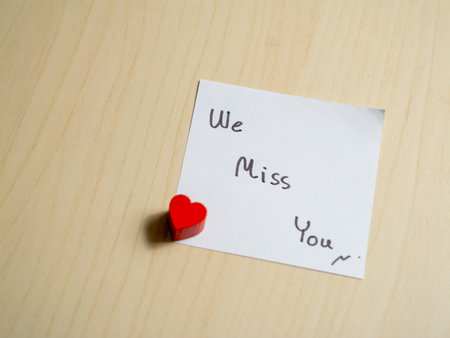 Heartfelt message home desk note personal space close-up connection and longingの写真素材