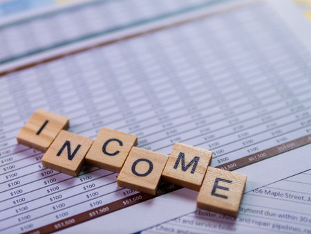 An in-depth look at income statistics through detailed financial documents in a professional environment.の写真素材