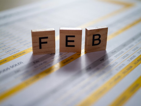 Analyzing February's financial data through structured documents a desktop.の写真素材