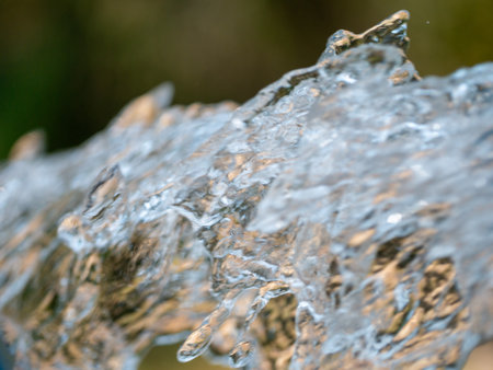 Witness the intricate details of flowing water captured in a stunning macro shot.の写真素材