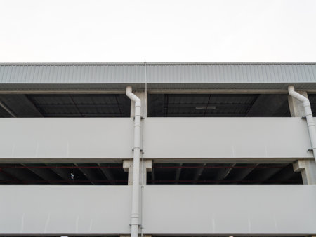 A detailed look at the architecture of a multi-story parking garage in an urban environment.の写真素材