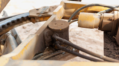 A close-up of a hydraulic system showcasing its components and maintenance in an urban construction...