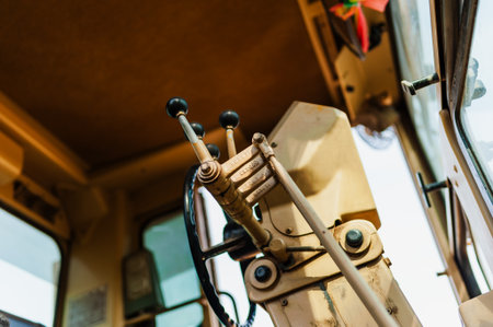 Explore the intricate control mechanics of heavy machinery in a bustling construction site.