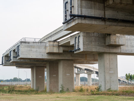 A detailed look at the ongoing construction of an elevated bridge in an urban setting showcasing architectural progress.の写真素材
