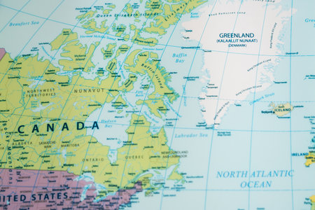 Detailed exploration of North America and Greenland's geography through a vibrant map.