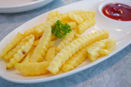 A close-up of crispy crinkle-cut fries served with ketchup perfect for a delightful snack.
