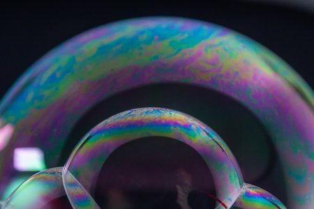 Explore the mesmerizing details of soap bubbles showcasing vibrant colors and intricate patterns.の写真素材