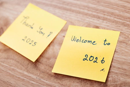 Two Thank you 2025 and Welcome to 2026 sticky notes conveying gratitude and welcome for the coming year 2026.の写真素材