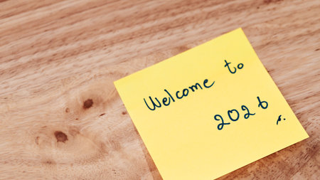 A motivational sticky note greets the year 2026 symbolizing fresh starts and new goals.の写真素材