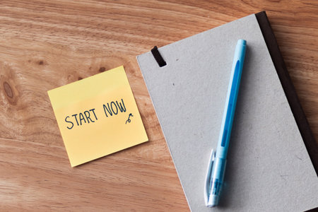 A motivational note encourages action placed thoughtfully a minimalist desk to inspire productivity.
