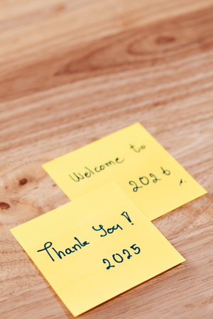 Thank you 2025 and Welcome to 2026 sticky notes highlight goals for 2025 emphasizing a positive mindset for the future.の写真素材