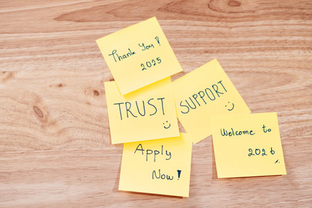 Sticky notes displaying messages of support and trust inspire motivation in a creative workspace.