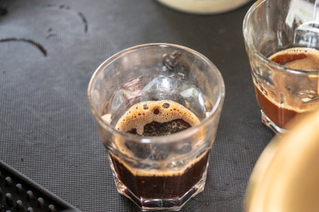 Discover the beauty of crafting coffee in a warm inviting kitchen showcasing the artful brewing...