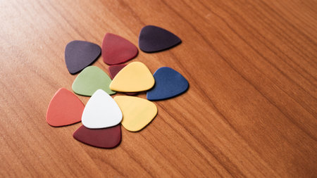 A vivid array of guitar picks displayed wood showcasing creativity and artistry in a unique setting.