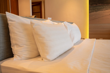 A serene hotel room featuring plush pillows and a calming atmosphere perfect for relaxation.の写真素材