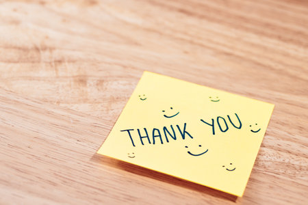 A simpleThank You note brings warmth and appreciation to any workspace.の写真素材