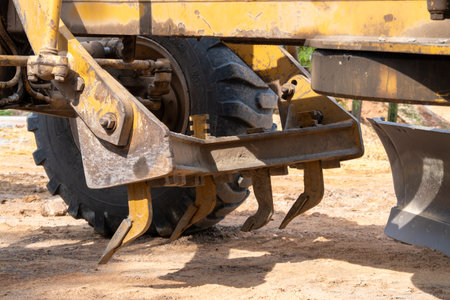 Explore the intricate details of a heavy machinery's earthmoving tools at a construction site.の写真素材