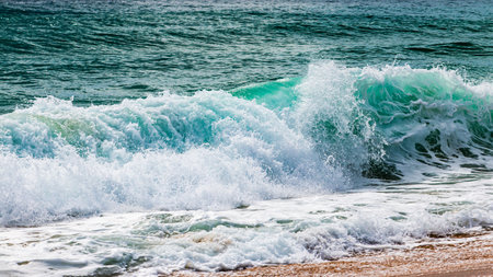 Experience the beauty of waves crashing against the shore capturing nature's serene moment at the beach.の写真素材