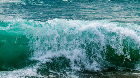 Experience the dynamic energy of ocean waves crashing against the shore in a captivating coastal setting.の写真素材