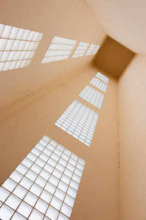 Explore the stunning interplay of light and structure in this architectural masterpiece.の写真素材