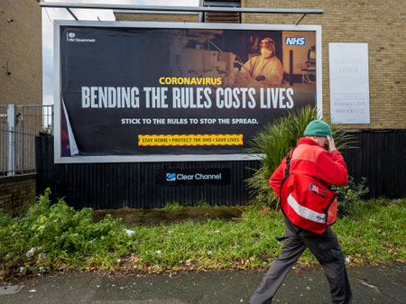 London. UK. 01.30.2021. A government billboard poster telling the public not to bend Covid-19 lockdown rules.のeditorial素材