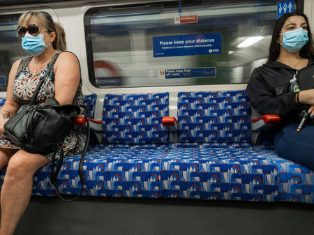 London. 10.09.2020. Passengers using public transport wearing face covering and social distancing...