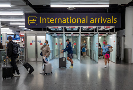 Sussex.UK. 08.06.2020. The international arrivals lounge of Gatwick Airport north terminal with arriving passengers exiting the gate.のeditorial素材