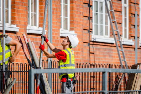 London. UK. 09.05.2020. A young caucasian man working in the construction industry.