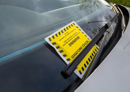 11.07.2020.London.UK. A penalty notice or ticket on the windscreen of a car.のeditorial素材